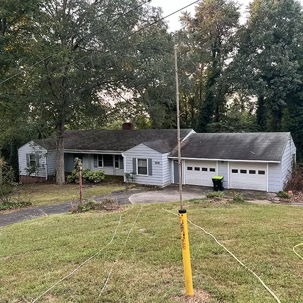 Before: Roof And Concrete Pressure Washing